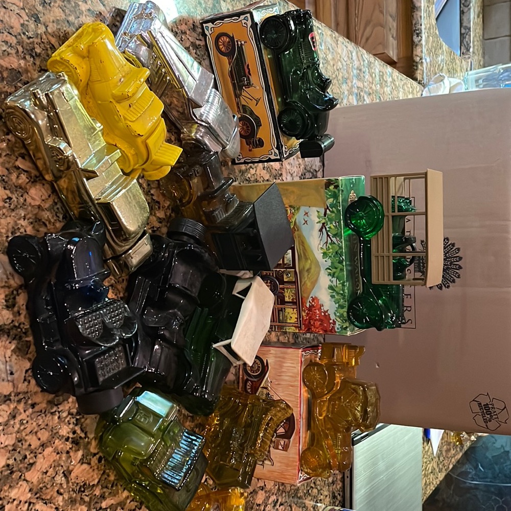 Various Avon bottles. Some with boxes. Automotive themed. $40 for all 12